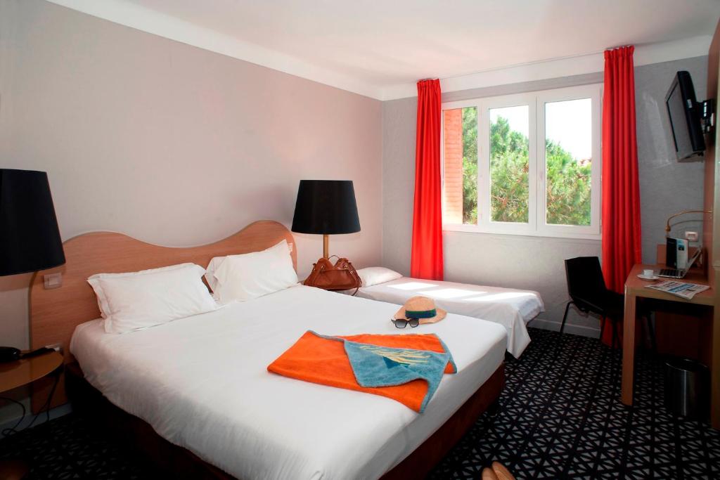 Postel nebo postele na pokoji v ubytování Hôtel Beau Rivage