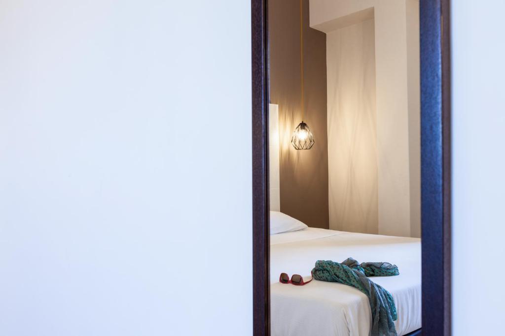 Postel nebo postele na pokoji v ubytování ibis styles Trani