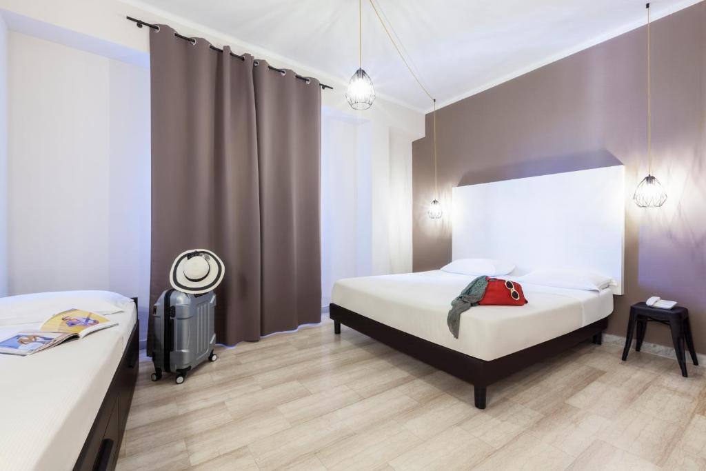 Postel nebo postele na pokoji v ubytování ibis styles Trani