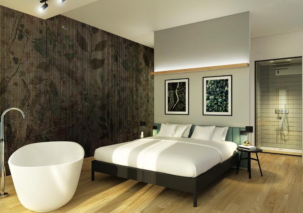 Cama o camas de una habitación en Meg Lifestyle Hotel & Apartaments