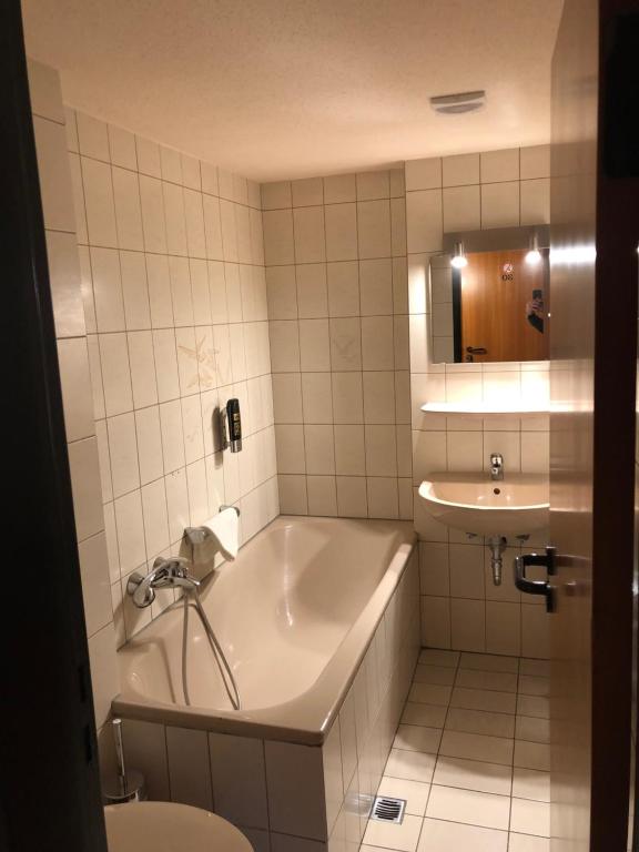 Koupelna v ubytování Hotel Poseidon