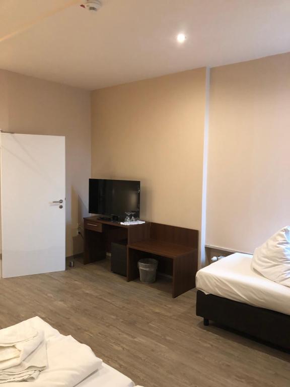 Postel nebo postele na pokoji v ubytování Hotel Poseidon