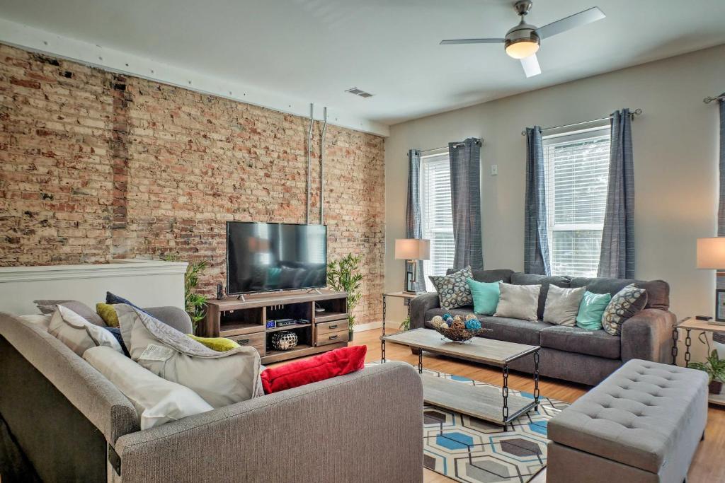 a living room with two couches and a tv at Cityscape 1 - Sleeps 7 in Chattanooga