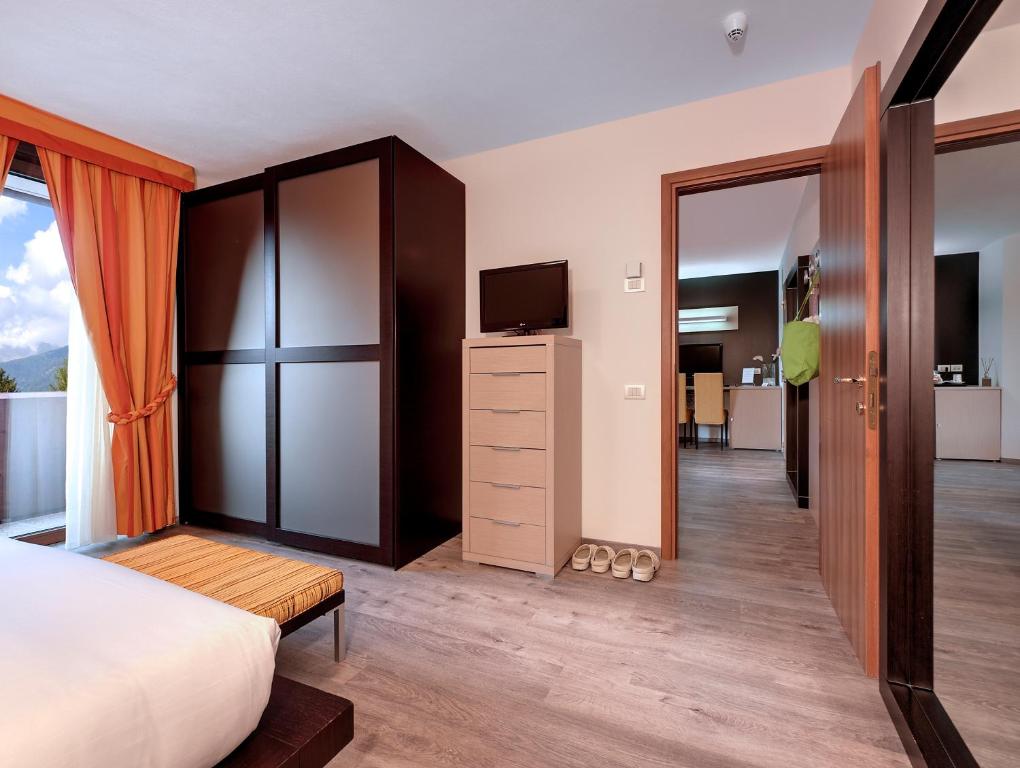 Postel nebo postele na pokoji v ubytování Luna Wellness Hotel
