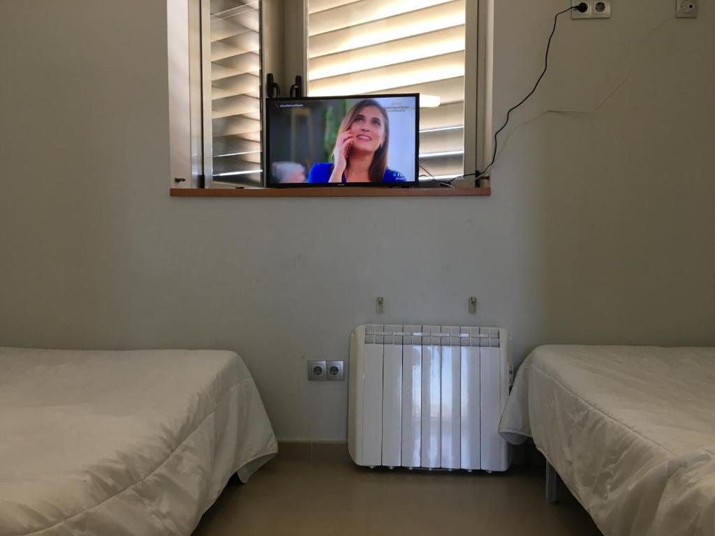Postel nebo postele na pokoji v ubytování TuAlbergueJT