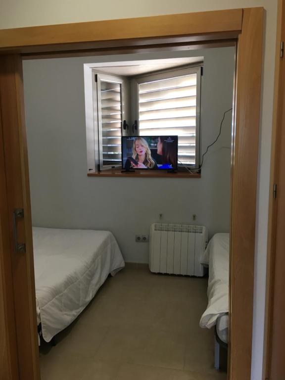 TV a/nebo společenská místnost v ubytování TuAlbergueJT
