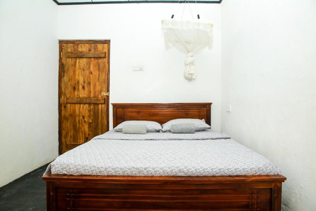 Postel nebo postele na pokoji v ubytování Kodi Beach Home