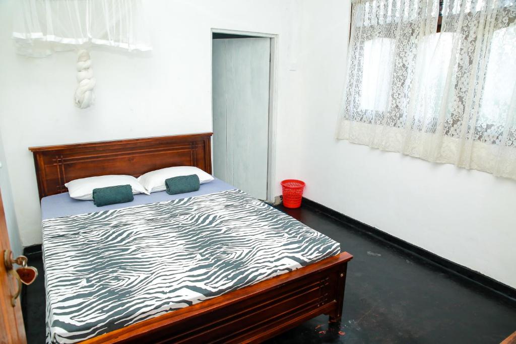 Postel nebo postele na pokoji v ubytování Kodi Beach Home