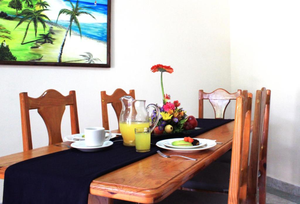 a dining room table with a black table cloth and a table at Coral Ixtapa in Ixtapa