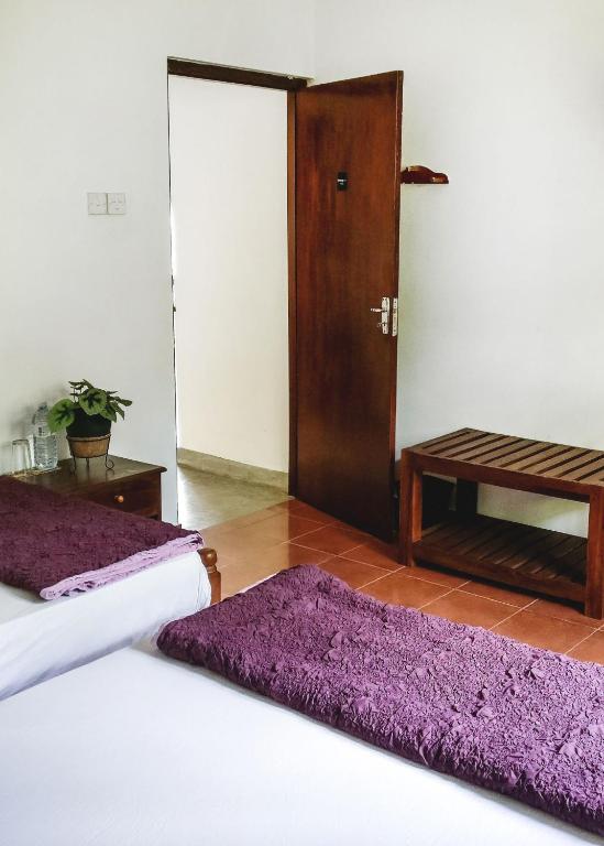 Postel nebo postele na pokoji v ubytování Holiday Stay Inn