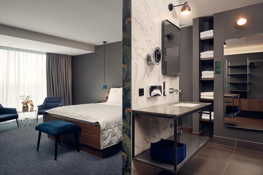 Postel nebo postele na pokoji v ubytování Van der Valk Hotel Eindhoven