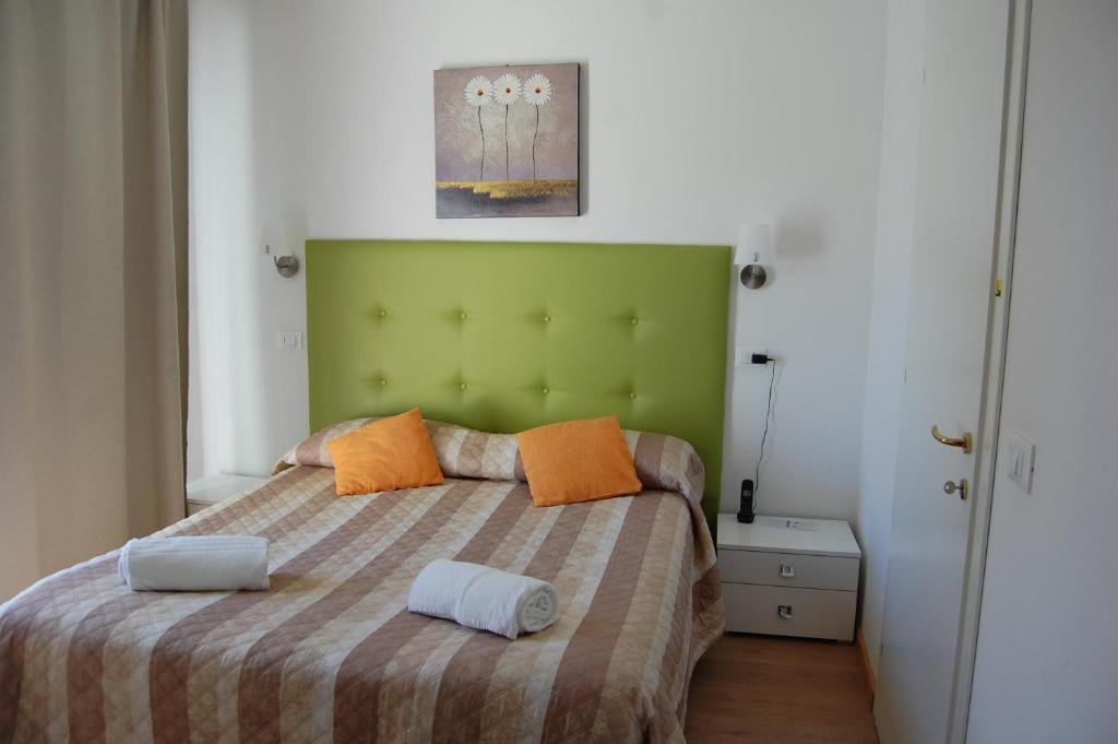 Postel nebo postele na pokoji v ubytování Hotel Irene