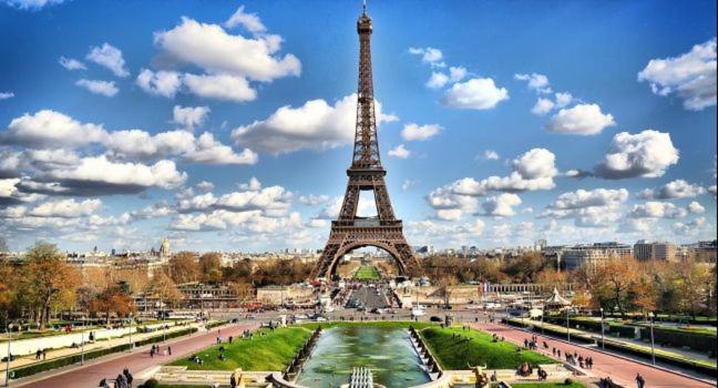 a view of the eiffel tower on a sunny day at Champs Elysees Flat in Paris
