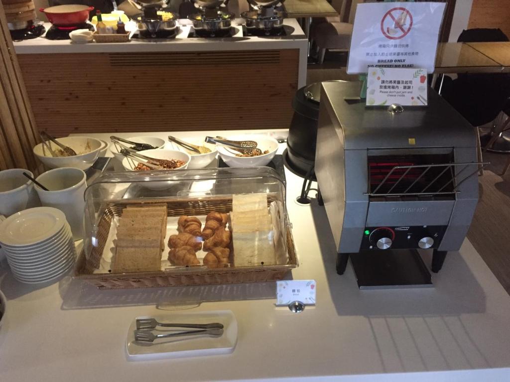 a food cart with pastries on a counter at The Tree House in Kaohsiung