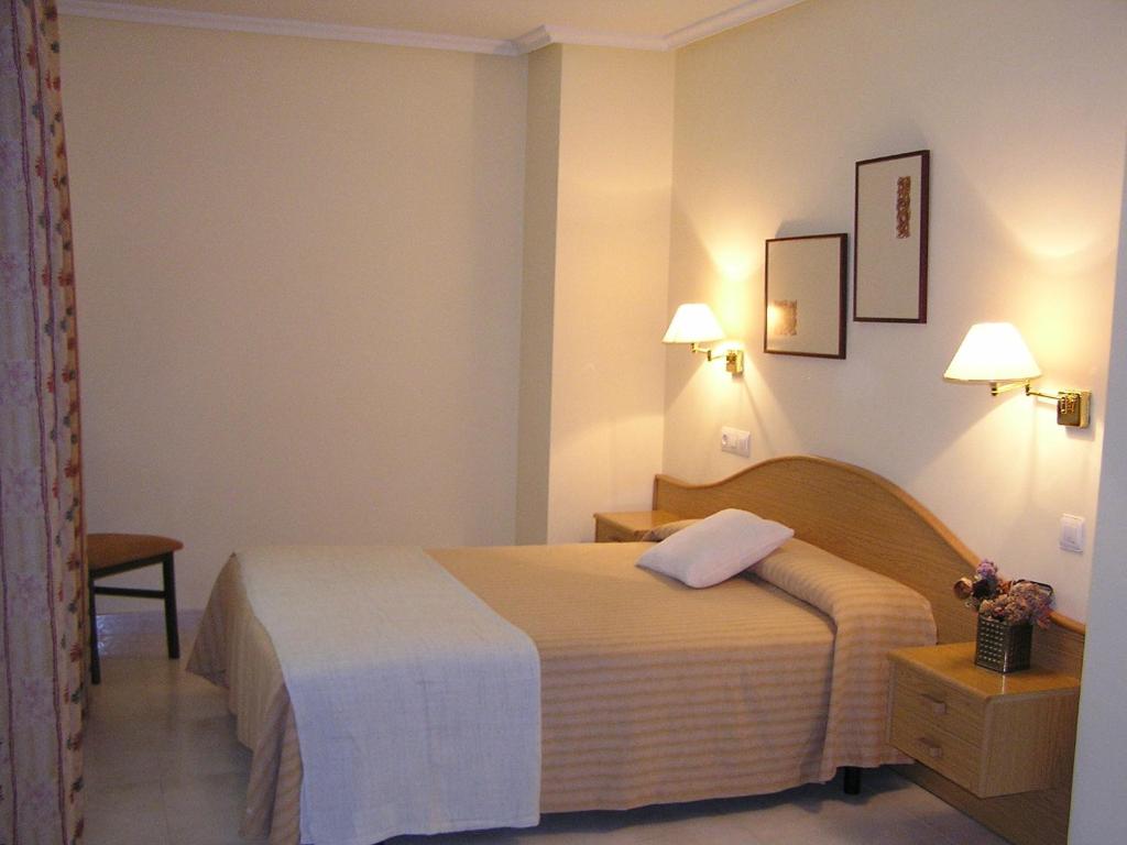 Posteľ alebo postele v izbe v ubytovaní Hotel La Brañina