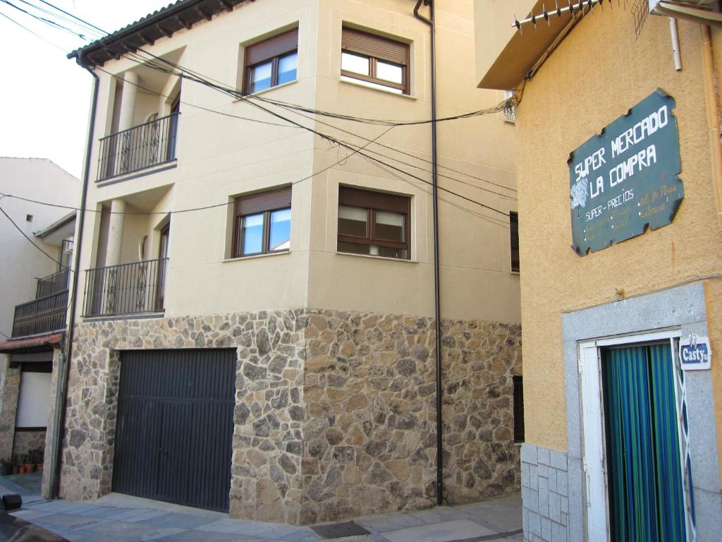 a building with a sign on the side of it at EL CHORRO DE JERTE in Jerte