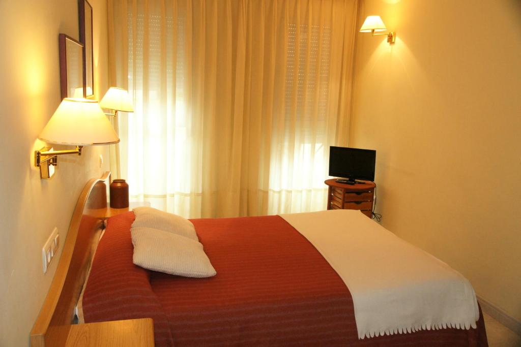 Posteľ alebo postele v izbe v ubytovaní Hotel La Brañina