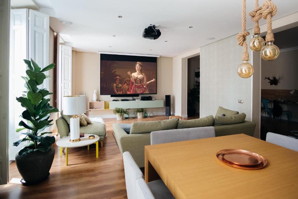 a living room with a couch and a table at Heima Puerta del Sol - Palacio Real in Madrid