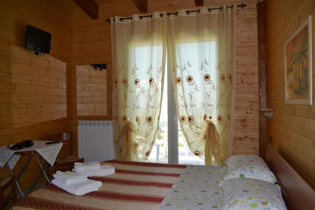 Postel nebo postele na pokoji v ubytování BeB Casa Di Lety