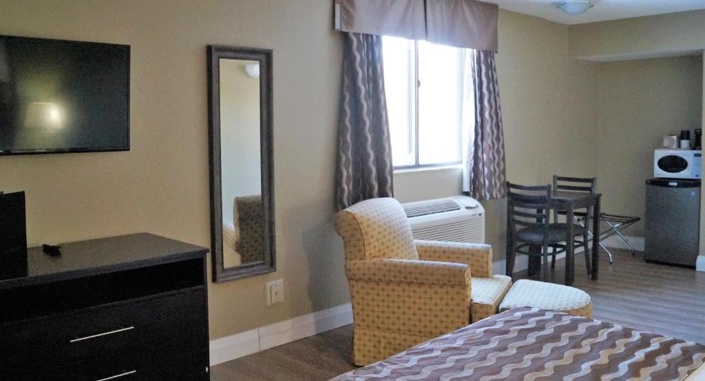 A television and/or entertainment centre at red maple inn and suites