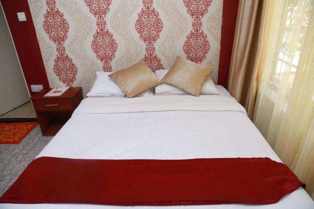 Postel nebo postele na pokoji v ubytování Hotel Embassy