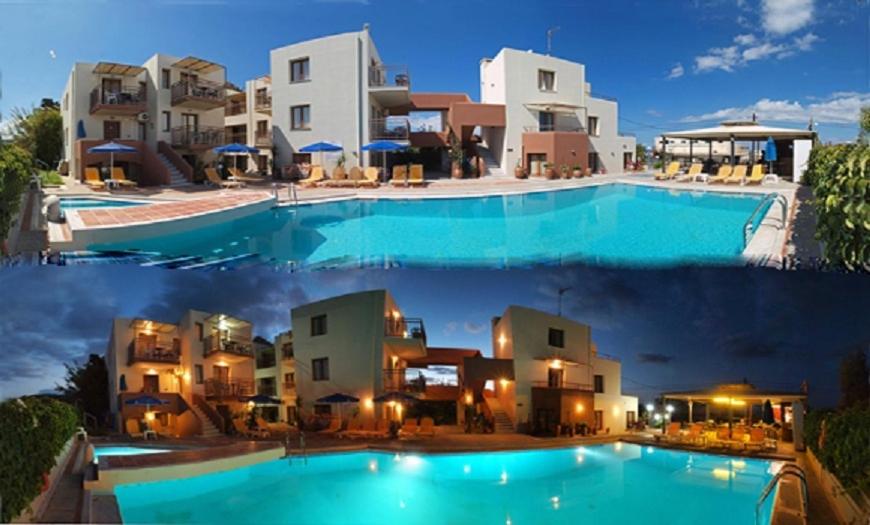 a large swimming pool in front of some buildings at Alexandros M in Maleme