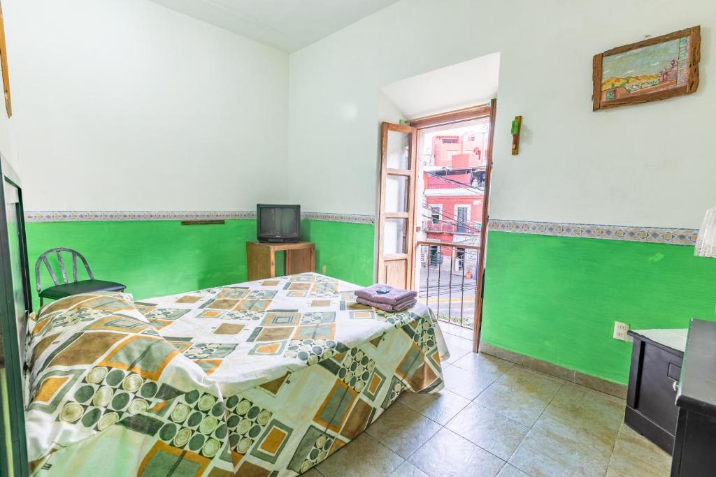 Postel nebo postele na pokoji v ubytování Hospedaje Del Campanero 19