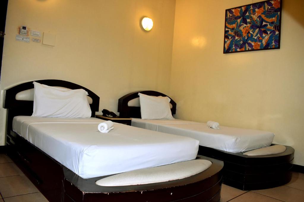 Postel nebo postele na pokoji v ubytování Hotel Nicanor