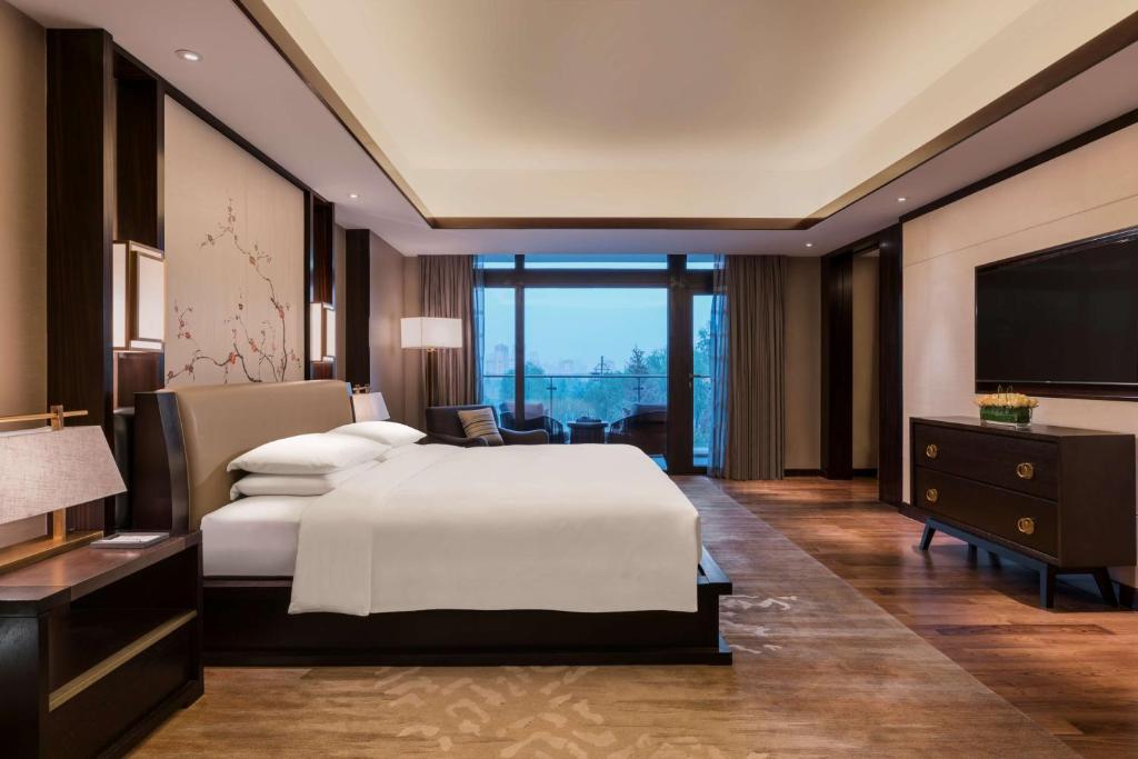 Postel nebo postele na pokoji v ubytování Hyatt Regency Xi'an