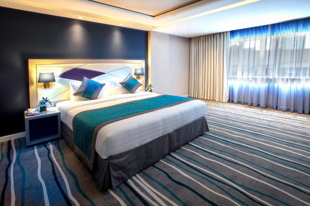 Postel nebo postele na pokoji v ubytování Al Sarab Hotel