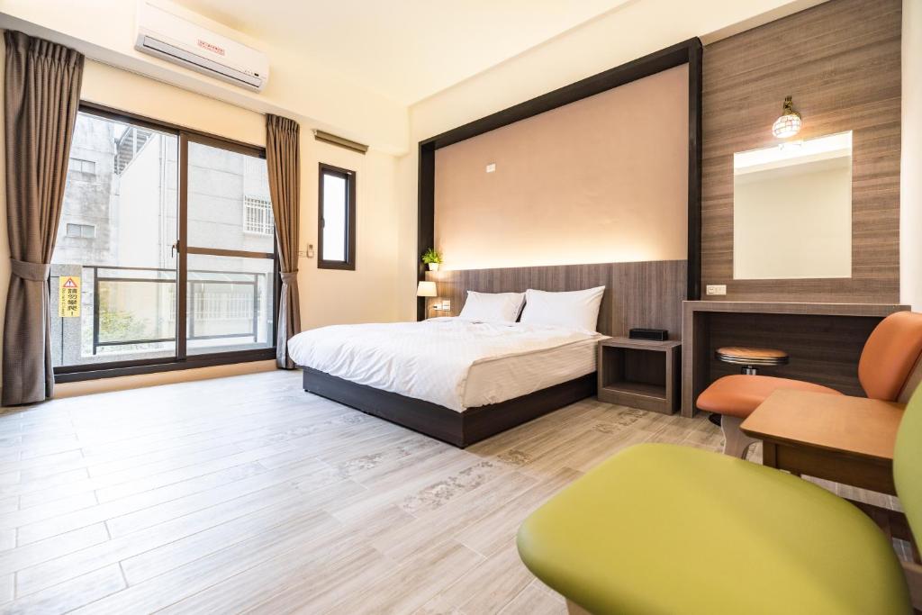 Postel nebo postele na pokoji v ubytování Rhino Guest House