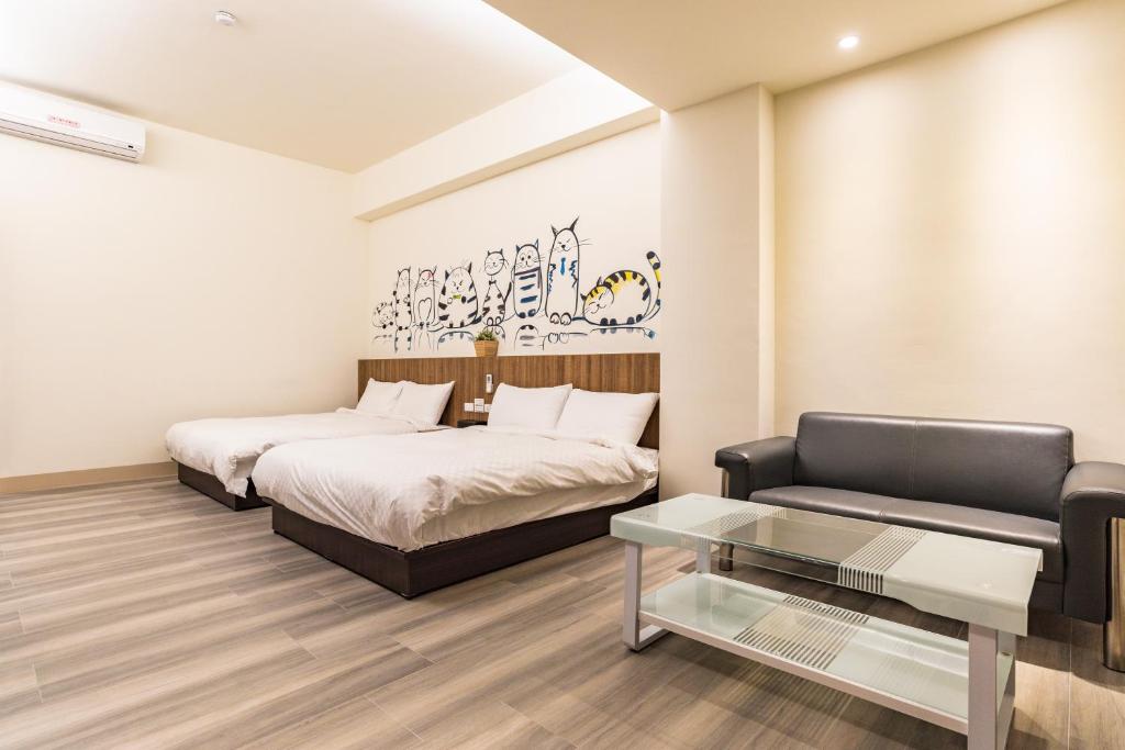 Postel nebo postele na pokoji v ubytování Rhino Guest House