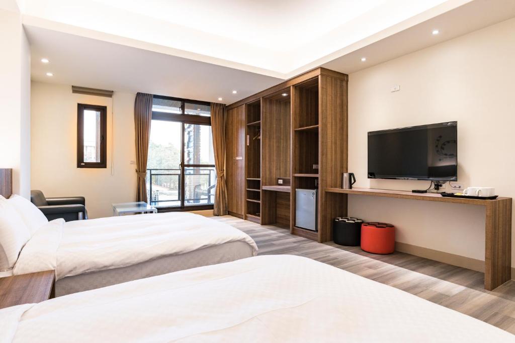 Postel nebo postele na pokoji v ubytování Rhino Guest House