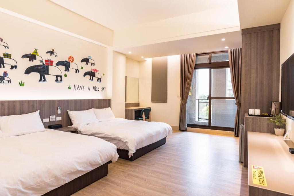 Postel nebo postele na pokoji v ubytování Rhino Guest House