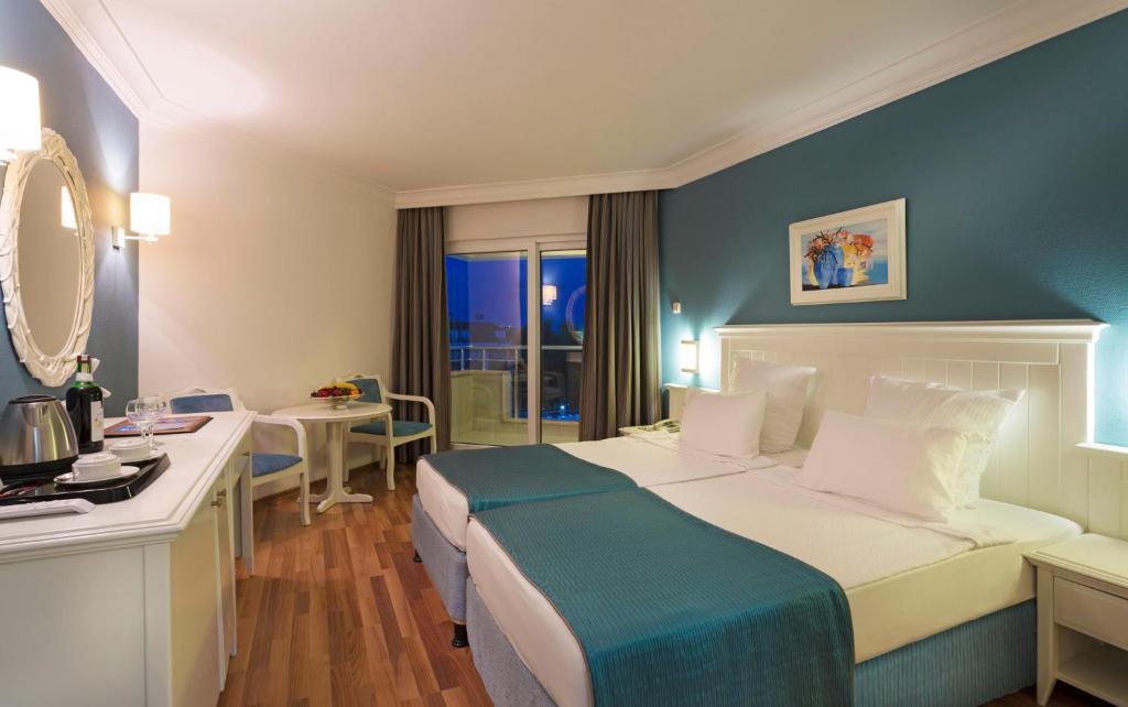 Postel nebo postele na pokoji v ubytování Hotel Terrace Beach Resort All Inclusive