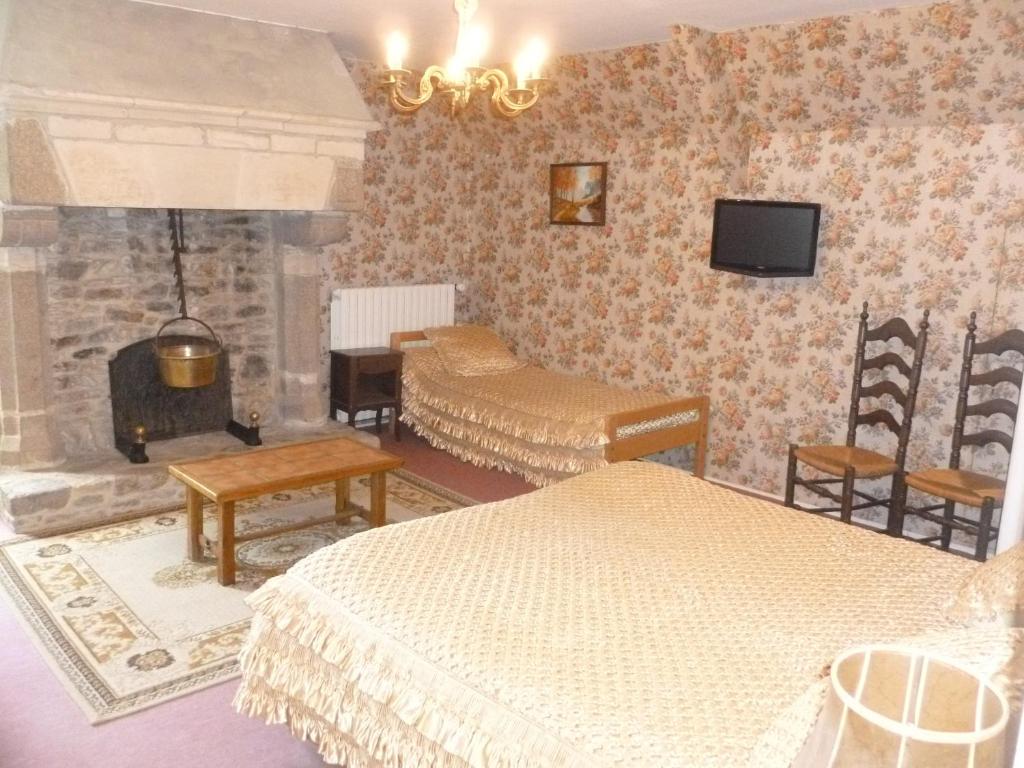 Postel nebo postele na pokoji v ubytování Manoir de la Foulerie