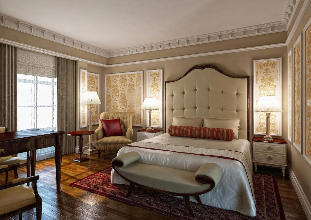 Un pat sau paturi într-o cameră la Warwick Doha