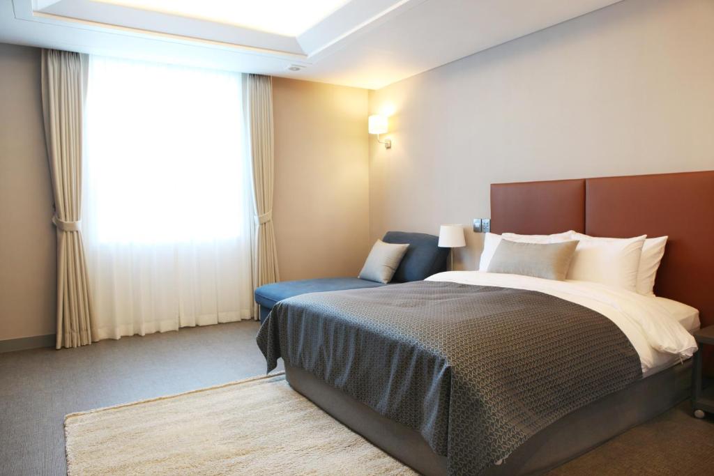 Postel nebo postele na pokoji v ubytování Polaris Hotel