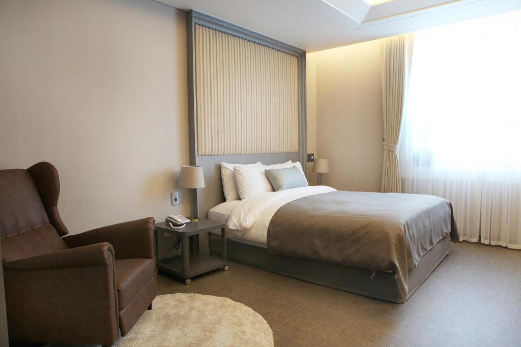 Postel nebo postele na pokoji v ubytování Polaris Hotel