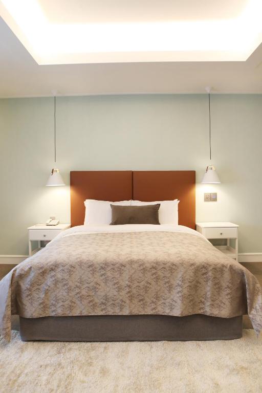 Postel nebo postele na pokoji v ubytování Polaris Hotel