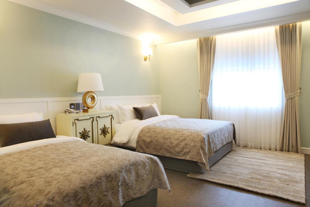 Postel nebo postele na pokoji v ubytování Polaris Hotel