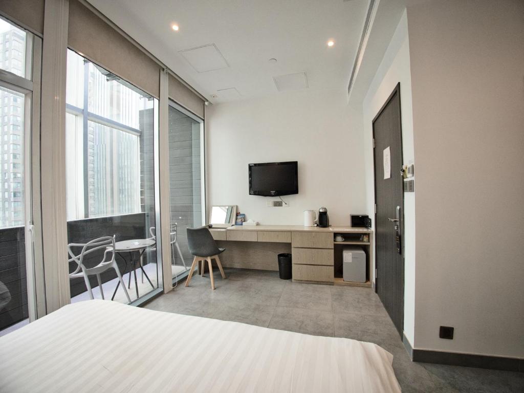 TV a/nebo společenská místnost v ubytování Wifi Boutique Hotel
