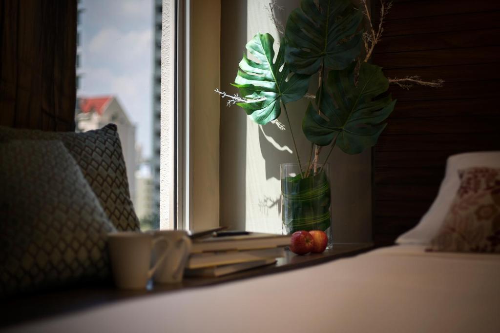 Postel nebo postele na pokoji v ubytování Value Hotel Thomson