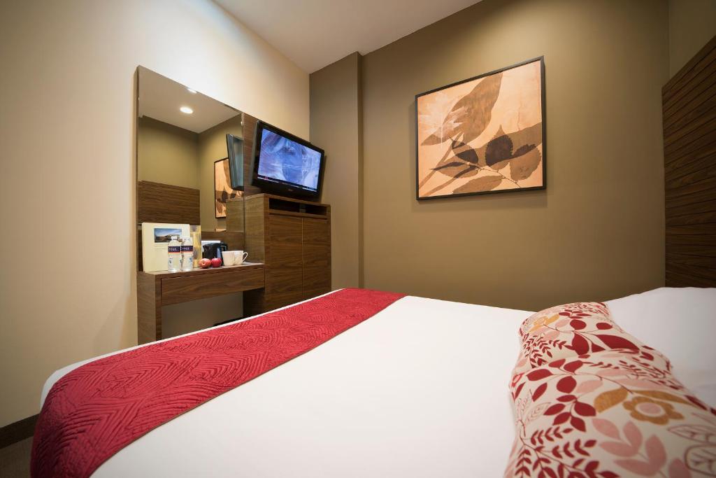 Postel nebo postele na pokoji v ubytování Value Hotel Thomson