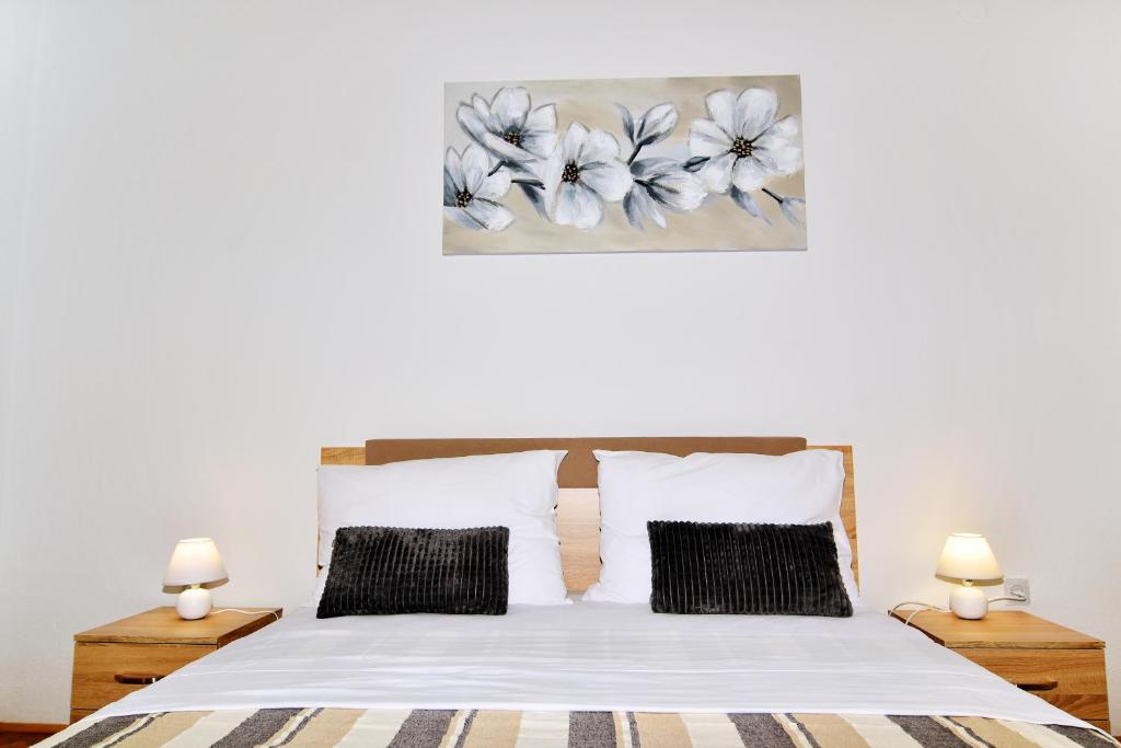 Postel nebo postele na pokoji v ubytování Apartman Nina