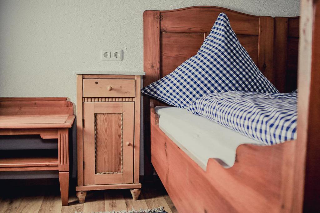 Postel nebo postele na pokoji v ubytování Gasthof Kornbachtal