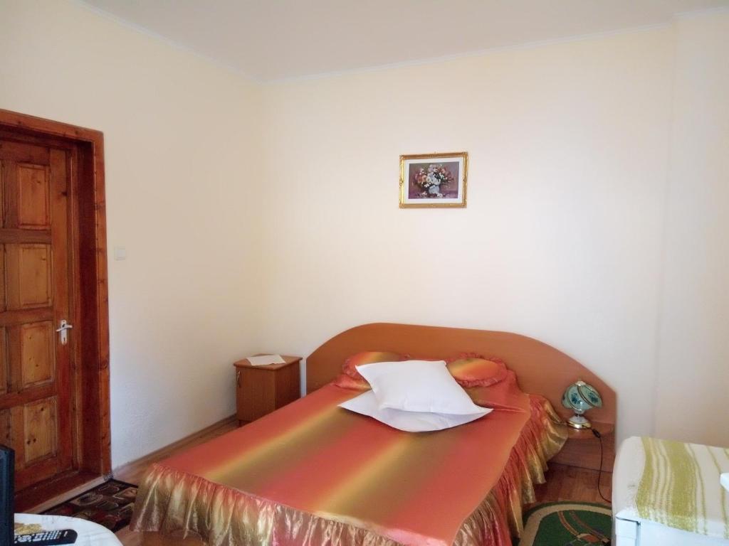 Postel nebo postele na pokoji v ubytování Casa Olanescu