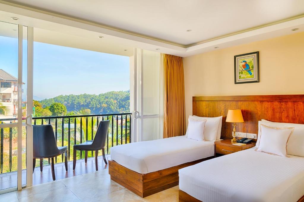 Postel nebo postele na pokoji v ubytování Serene Kandy
