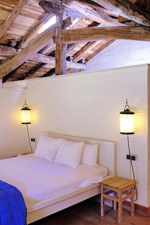 Postel nebo postele na pokoji v ubytování Mañarinegi Apartamentos Rurales