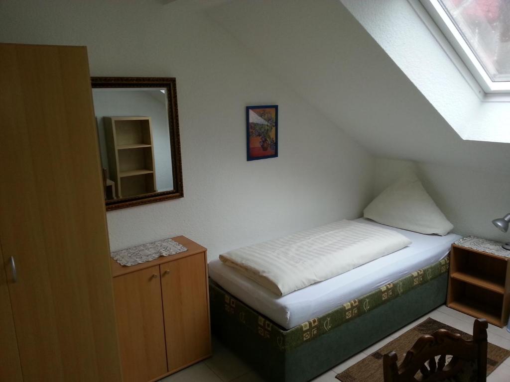 Postel nebo postele na pokoji v ubytování Hotel Am Kamin